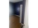 This bedroom features dark blue walls and flooring at 818 W 27Th St, Indianapolis, IN 46208