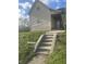 Exterior view of the home, showing the steps leading up to the front porch at 818 W 27Th St, Indianapolis, IN 46208