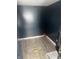 The storage room features blue walls and laminate flooring at 818 W 27Th St, Indianapolis, IN 46208