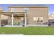 Spacious backyard with a covered patio, dining area, and plenty of room for outdoor living at 8327 Andrusia Ln, Indianapolis, IN 46237