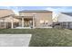 A home's backyard features a covered patio, grill, and partially dormant lawn at 8327 Andrusia Ln, Indianapolis, IN 46237