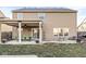 Expansive backyard with covered patio and ample room for outdoor activities at 8327 Andrusia Ln, Indianapolis, IN 46237