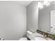 Modern half bathroom featuring beautiful countertops and fixtures at 8327 Andrusia Ln, Indianapolis, IN 46237