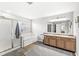Bright bathroom with a soaking tub, separate shower, and dual vanity sinks at 8327 Andrusia Ln, Indianapolis, IN 46237