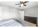 Bedroom features a ceiling fan, neutral walls, and traditional furnishings at 8327 Andrusia Ln, Indianapolis, IN 46237