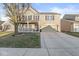 Beautiful two-story brick home showcasing a welcoming front porch and a spacious driveway at 8327 Andrusia Ln, Indianapolis, IN 46237