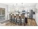 Stylish kitchen with white cabinets, stainless steel appliances, and a breakfast bar with seating at 8327 Andrusia Ln, Indianapolis, IN 46237