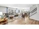 Spacious living room featuring hardwood floors, large windows, and modern furnishings at 8327 Andrusia Ln, Indianapolis, IN 46237