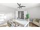 Bright office space with large desk, neutral walls, and ceiling fan at 8327 Andrusia Ln, Indianapolis, IN 46237