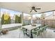 Covered patio area features seating and a ceiling fan, making it perfect for entertaining at 8327 Andrusia Ln, Indianapolis, IN 46237
