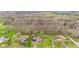Panoramic aerial view of a residential neighborhood near vast woodlands and open farmland at 874 S Sycamore Dr, Greenfield, IN 46140