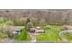 Aerial view of a residential neighborhood with tree-lined streets and well-maintained lawns at 874 S Sycamore Dr, Greenfield, IN 46140