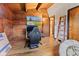 Finished attic featuring wood walls, a TV, ladder and gaming chair, offering a flexible, unique space at 874 S Sycamore Dr, Greenfield, IN 46140