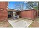 Covered patio with a table and chairs, offering a cozy outdoor living space adjacent to the house at 874 S Sycamore Dr, Greenfield, IN 46140