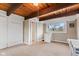 Bedroom with beamed ceiling, neutral walls, and views to the exterior at 874 S Sycamore Dr, Greenfield, IN 46140