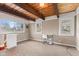This bedroom has a desk, natural lighting, and exposed beam ceiling at 874 S Sycamore Dr, Greenfield, IN 46140