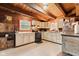Charming kitchen with light-colored cabinetry, black appliances, and a bright window at 874 S Sycamore Dr, Greenfield, IN 46140