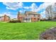 Large backyard with a charming gazebo, offering a tranquil retreat with ample green space and landscaping at 9319 Oak Knoll Ln, Fishers, IN 46037