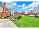 Lush backyard featuring a gazebo, playset, and manicured lawn, ideal for outdoor relaxation and entertaining at 9319 Oak Knoll Ln, Fishers, IN 46037