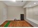 Unfinished basement space with vinyl floors, built-in bench seating, and neutral paint at 9319 Oak Knoll Ln, Fishers, IN 46037