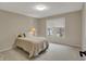 Bright bedroom with a window overlooking the beautiful landscape, creating a peaceful and inviting atmosphere at 9319 Oak Knoll Ln, Fishers, IN 46037