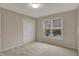 Inviting bedroom featuring neutral walls and a window, offering a serene space for rest and relaxation at 9319 Oak Knoll Ln, Fishers, IN 46037