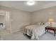 Bright bedroom featuring neutral paint and carpet, with a side table and lamp at 9319 Oak Knoll Ln, Fishers, IN 46037