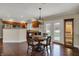 Kitchen dining area with wood floors and plenty of natural light from the sliding doors at 9319 Oak Knoll Ln, Fishers, IN 46037