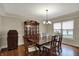 Traditional dining room with hardwood floors, a china cabinet and a chandelier at 9319 Oak Knoll Ln, Fishers, IN 46037