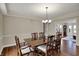 Formal dining room featuring a wood table, hardwood floors and neutral paint at 9319 Oak Knoll Ln, Fishers, IN 46037