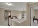 An upstairs hallway with views of multiple bedrooms at 9319 Oak Knoll Ln, Fishers, IN 46037