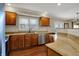 Updated kitchen with granite countertops, stainless steel appliances and hardwood floors at 9319 Oak Knoll Ln, Fishers, IN 46037