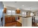 Open concept kitchen with granite countertops, stainless steel appliances, and hardwood floors at 9319 Oak Knoll Ln, Fishers, IN 46037
