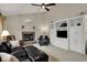 A living room features a fireplace and built-in shelving at 9319 Oak Knoll Ln, Fishers, IN 46037