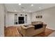 Basement living room with tv and built in shelves, plus comfortable couches and seating at 9319 Oak Knoll Ln, Fishers, IN 46037