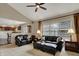 A living room features a fireplace and large windows next to the kitchen and dining area at 9319 Oak Knoll Ln, Fishers, IN 46037
