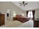 A main bedroom features vaulted ceilings and neutral carpet with access to a walk-in closet at 9319 Oak Knoll Ln, Fishers, IN 46037