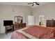 Spacious main bedroom featuring neutral walls, plush carpet, and multiple closets for ample storage space at 9319 Oak Knoll Ln, Fishers, IN 46037