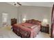 Spacious main bedroom featuring neutral walls, plush carpet, and an ensuite bathroom for added convenience at 9319 Oak Knoll Ln, Fishers, IN 46037