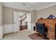 Cozy home office with an antique rolltop desk and a view towards the staircase at 9319 Oak Knoll Ln, Fishers, IN 46037
