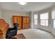 Bright office space with neutral carpet, ample natural light, and classic wooden furniture at 9319 Oak Knoll Ln, Fishers, IN 46037