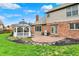 Patio and gazebo area with a built-in grill, ideal for outdoor cooking and relaxing in a landscaped setting at 9319 Oak Knoll Ln, Fishers, IN 46037