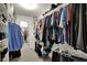 Walk-in closet with custom shelving and ample hanging space for organization and storage at 9319 Oak Knoll Ln, Fishers, IN 46037