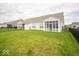 Spacious backyard with lush green grass, perfect for outdoor entertaining and relaxation at 9455 Orchard Cove Dr, Indianapolis, IN 46239