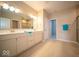 A luxurious bathroom with double sinks, tiled floor, and a separate shower at 9455 Orchard Cove Dr, Indianapolis, IN 46239