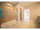 Bathroom featuring a tiled shower with a glass door and neutral tile at 9455 Orchard Cove Dr, Indianapolis, IN 46239