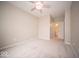 Spacious bedroom with soft carpet, neutral walls, and access to a bathroom at 9455 Orchard Cove Dr, Indianapolis, IN 46239