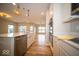 Well-equipped kitchen featuring an island, white cabinets, stainless steel appliances, and hardwood floors at 9455 Orchard Cove Dr, Indianapolis, IN 46239