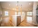A spacious kitchen featuring stainless steel appliances, an island, and ample lighting at 9455 Orchard Cove Dr, Indianapolis, IN 46239
