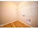 Functional laundry room with vinyl floors and storage shelves for organization at 9455 Orchard Cove Dr, Indianapolis, IN 46239